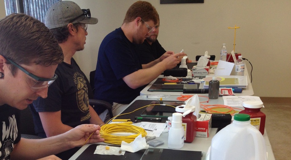 Students terminating fiber optic cable during a class
